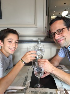 Toasting our first meal with l'eau gazeuse